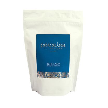 Blue Lady flavoured black tea from PekoeTea Edinburgh in a resealable 250g pouch, showcasing the vibrant tea leaves.