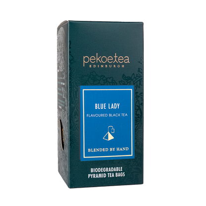 Blue Lady flavored black tea in PekoeTea Edinburgh teabag box, featuring vibrant blue packaging and tea bags inside.