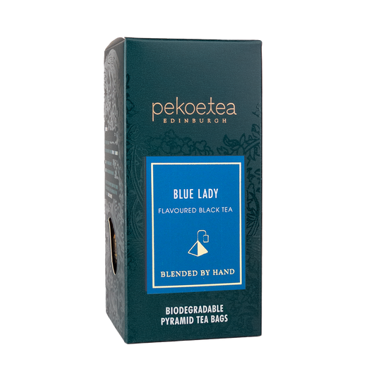 Blue Lady flavored black tea in PekoeTea Edinburgh teabag box, featuring vibrant blue packaging and tea bags inside.