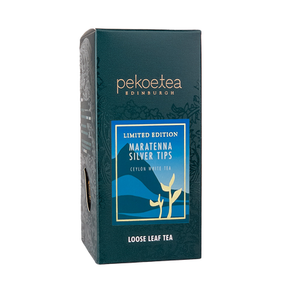 Loose leaf Ceylon Silver Tips tea from PekoeTea Edinburgh in a box, showcasing delicate silver-tipped tea leaves.