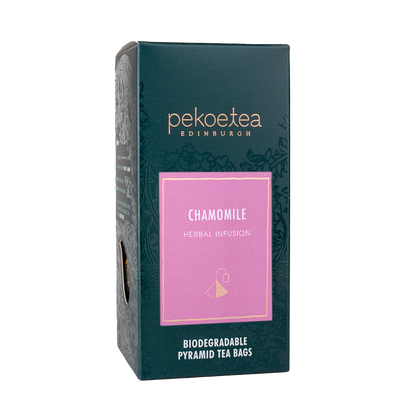 Box of PekoeTea Edinburgh chamomile herbal infusion tea bags with dried chamomile flowers visible inside.