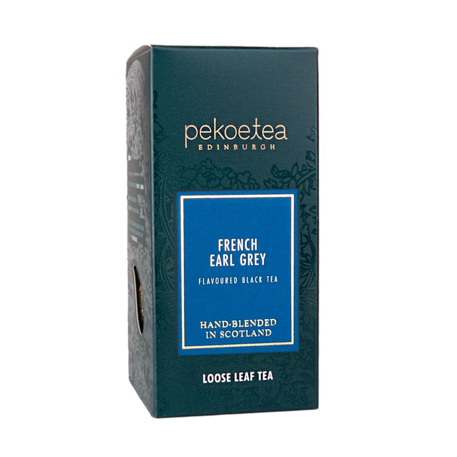 Loose leaf French Earl Grey tea by PekoeTea Edinburgh in a decorative box with tea leaves and a lemon slice.