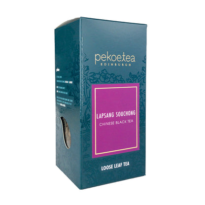 Box of PekoeTea Edinburgh Lapsang Souchong tea with black packaging and product label showing the tea variety.
