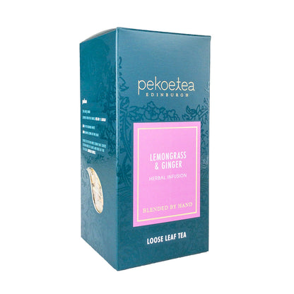 Box of PekoeTea Edinburgh Lemongrass and Ginger tea with fresh lemongrass and ginger ingredients visible inside the packaging.