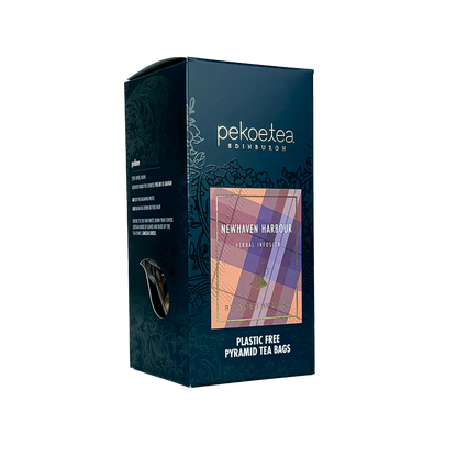Box of PekoeTea Edinburgh Newhaven Harbour blend tea with tea leaves and packaging.