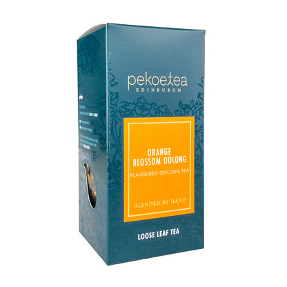 Box of PekoeTea Edinburgh Orange Blossom Oolong Tea with orange blossom scent and vibrant packaging.