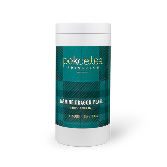 PekoeTea Edinburgh Jasmine Dragon Pearl green tea in a decorative caddy, featuring delicate pearl-shaped tea leaves and jasmine blossoms.