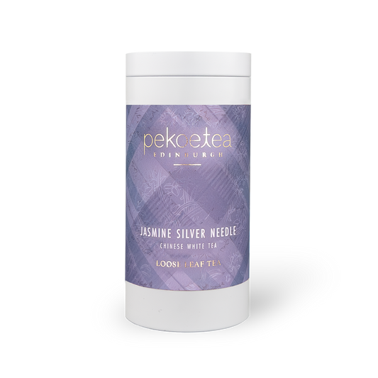 Fujian Jasmine Silver Needle White Tea in a decorative caddy, showcasing delicate white tea leaves infused with jasmine aroma.