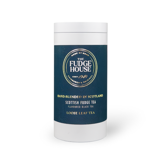 Loose leaf Scottish Fudge Tea by PekoeTea Edinburgh in a decorative caddy, showcasing rich, dark tea leaves with a fudge aroma.