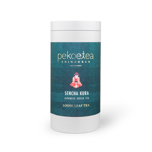 Sencha Kura Green Tea in a PekoeTea Edinburgh caddy, showcasing fresh green tea leaves in a decorative container.