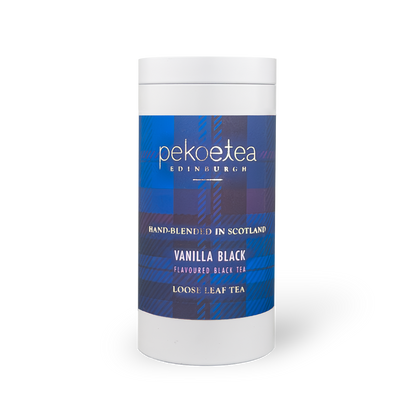 PekoeTea Edinburgh vanilla black tea in a decorative caddy, showcasing dark tea leaves infused with vanilla flavor.