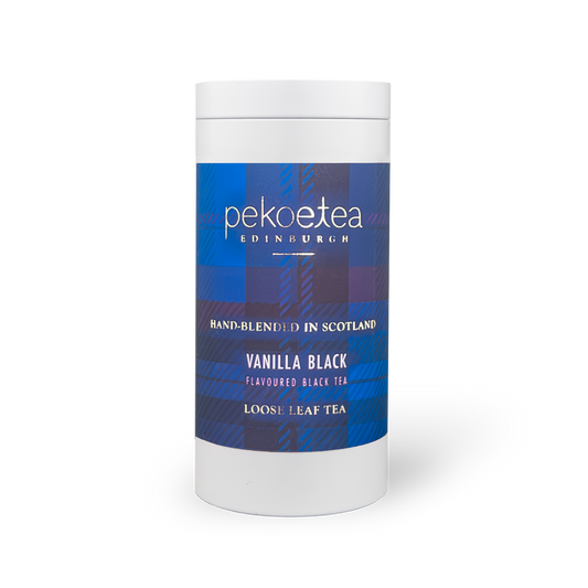 PekoeTea Edinburgh vanilla black tea in a decorative caddy, showcasing dark tea leaves infused with vanilla flavor.