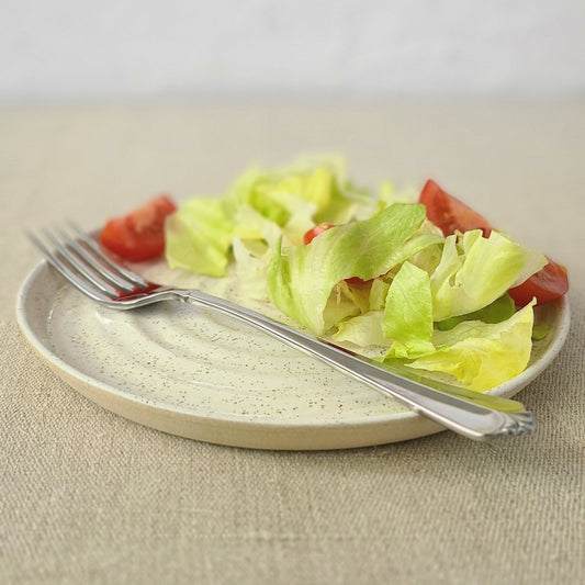 Pepper White classic lunch plate by Katie L Thompson Designs with salad and fork, ceramic dinnerware for everyday use.