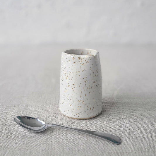 Pepper White Classic Mini Jug by Katie L Thompson Designs with a matching spoon, perfect for serving condiments or sauces.