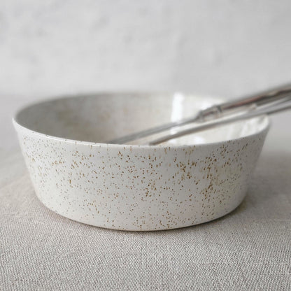 White ceramic Pepper White Classic Pasta Bowl by Katie L Thompson Designs with matching cutlery for serving pasta.
