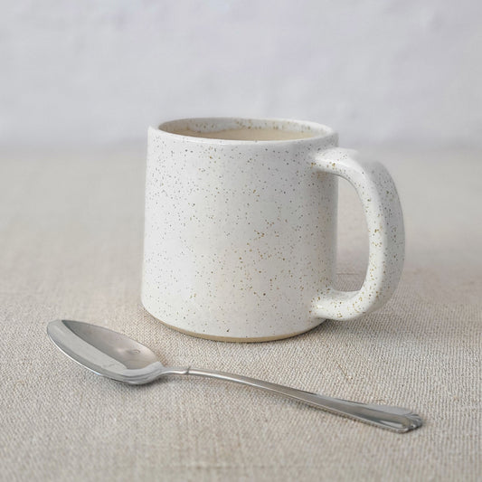 White ceramic Pepper White Classic Standard Mug with matching spoon, designed by Katie L Thompson Designs.