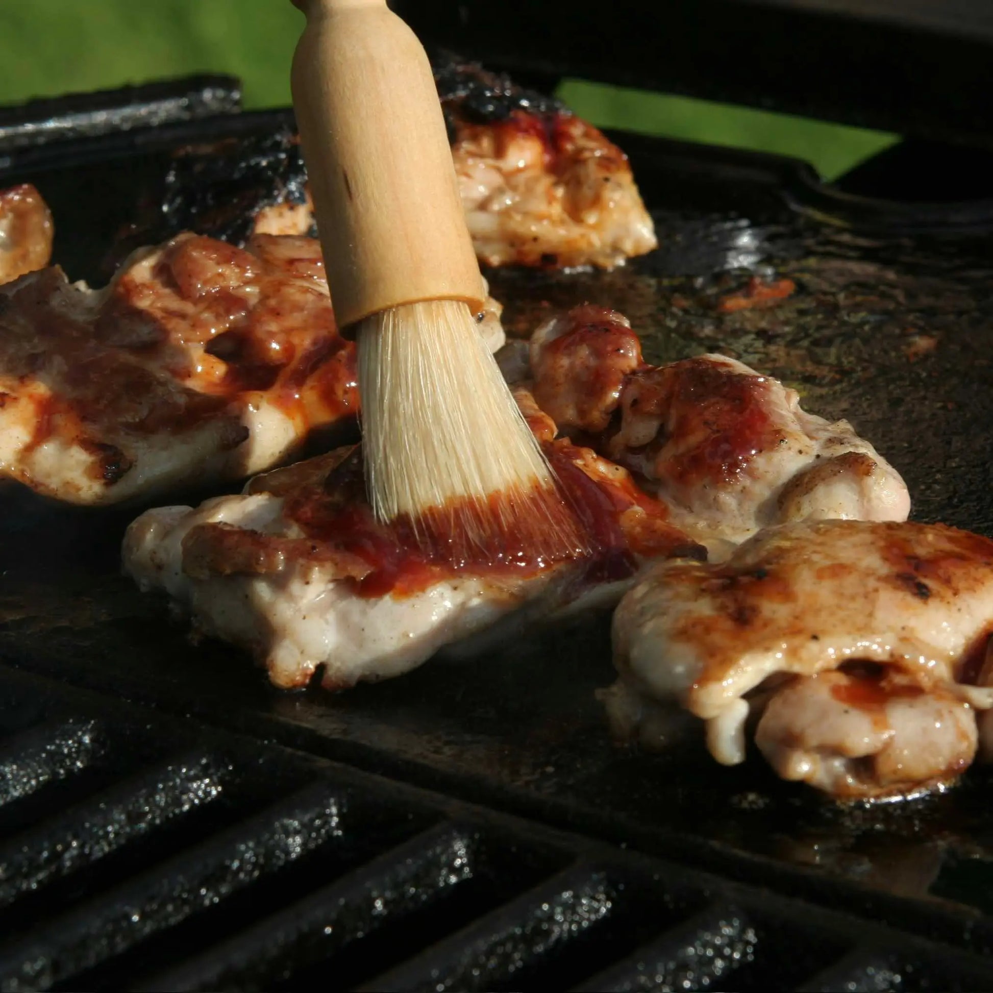 Hot Star Honey Korean BBQ Honey Sauce drizzled over grilled chicken, showcasing glossy, flavorful Korean BBQ sauce on a plate.