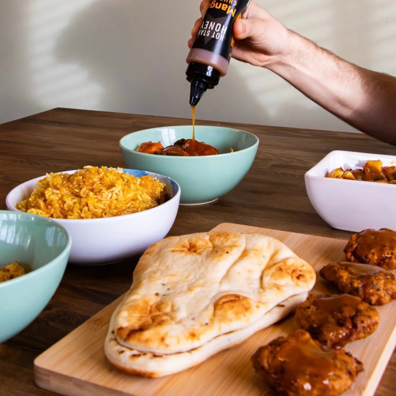 Hot Star Honey Hot Honey Sauce Trio gift set with mango and curry flavors in glass bottles, ideal for culinary gift giving.