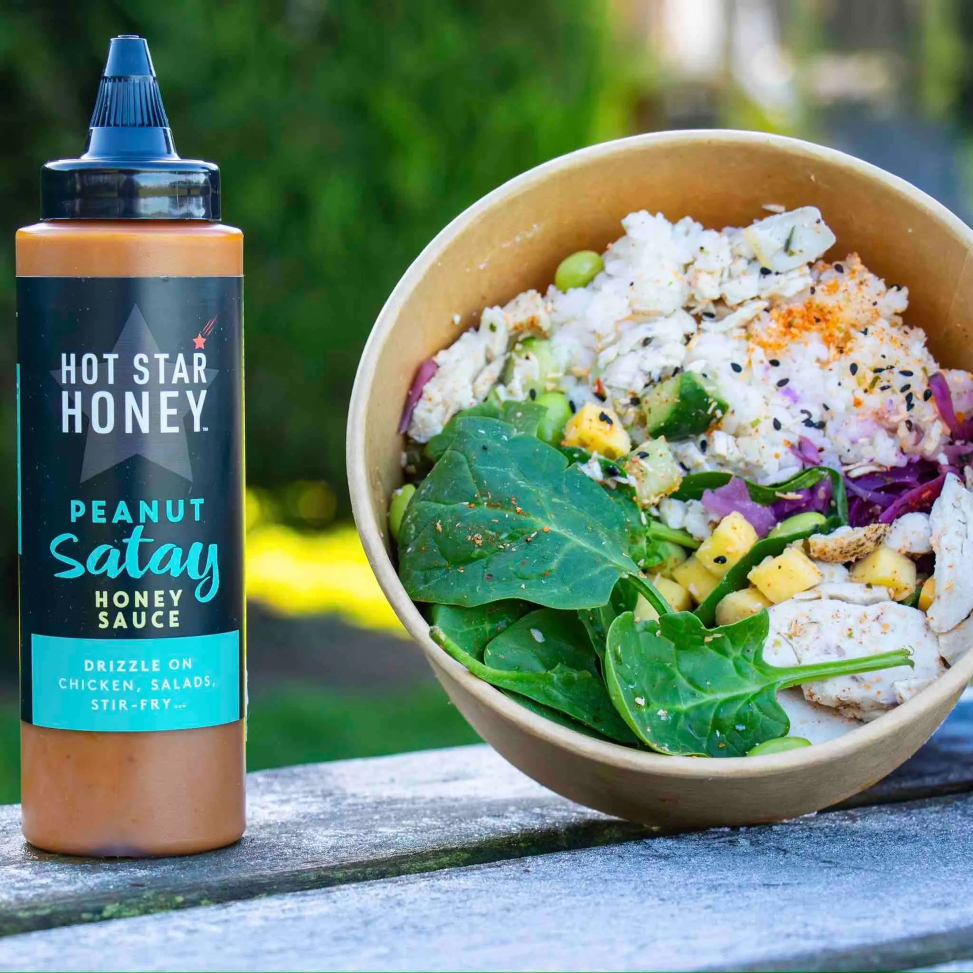 Asian-inspired peanut satay honey sauce drizzled over a dish, showcasing its rich, creamy texture and golden color.
