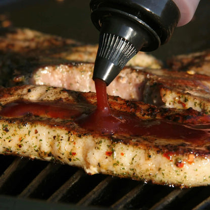 Korean BBQ honey sauce from Hot Star Honey drizzled over grilled steak, showcasing glossy, caramelized meat with sauce.