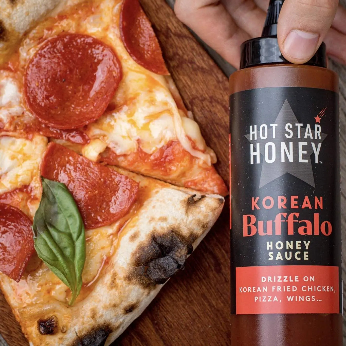 Korean Buffalo Honey Sauce on pizza, Asian-inspired hot honey sauce by Hot Star Honey drizzled over cheesy pizza slices.