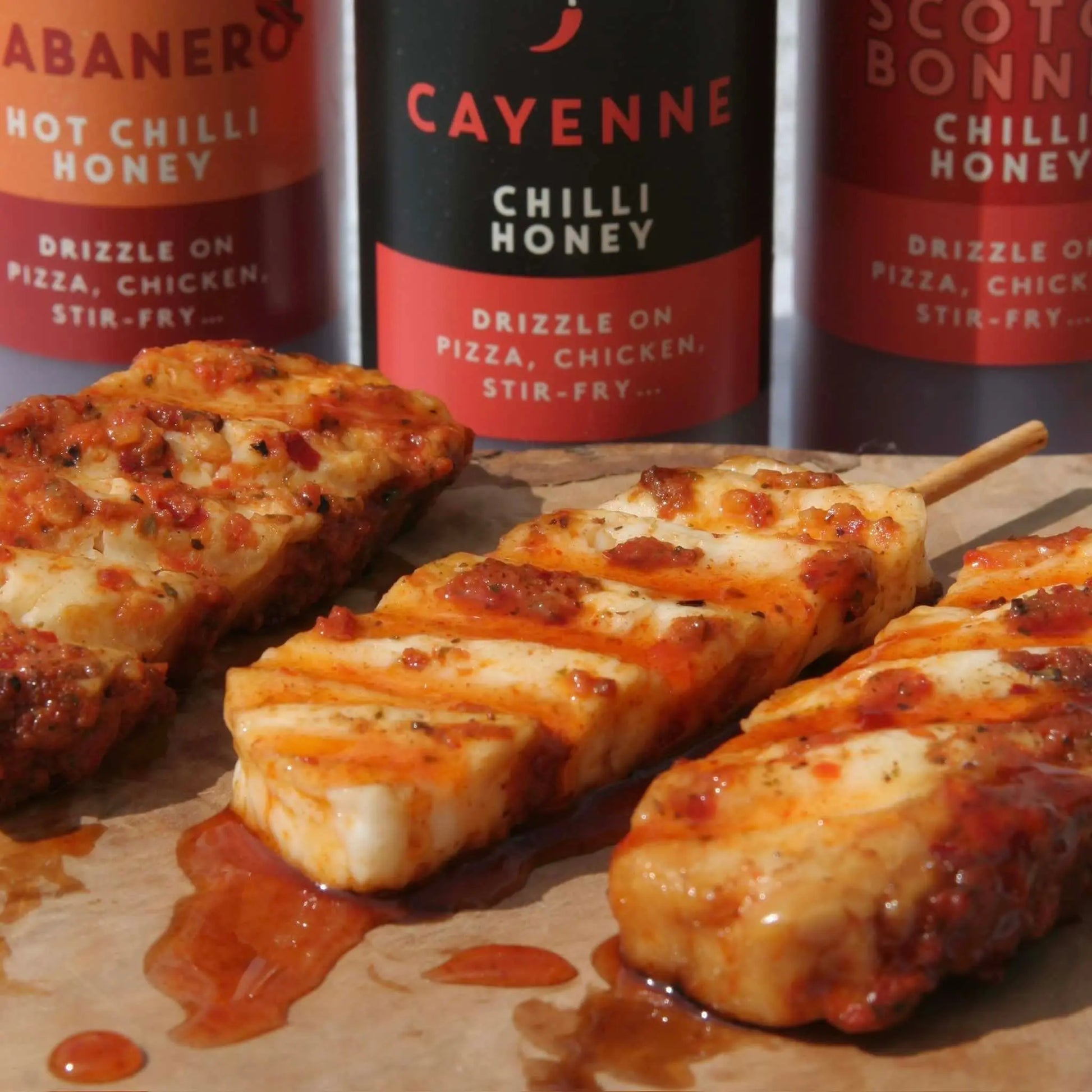 Hot Star Honey Asian Sauce Trio gift set featuring cayenne pepper sauce and flavorful sauces on halloumi cheese
