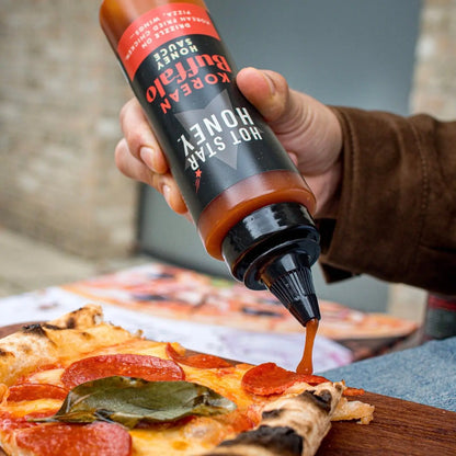 Korean Buffalo Honey Sauce on pizza showing a close-up of the spicy, sweet Asian-inspired sauce drizzled over toppings