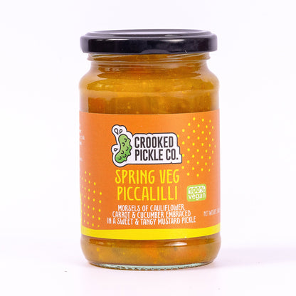 Piccalilli served alongside a pork pie and cheddar cheese