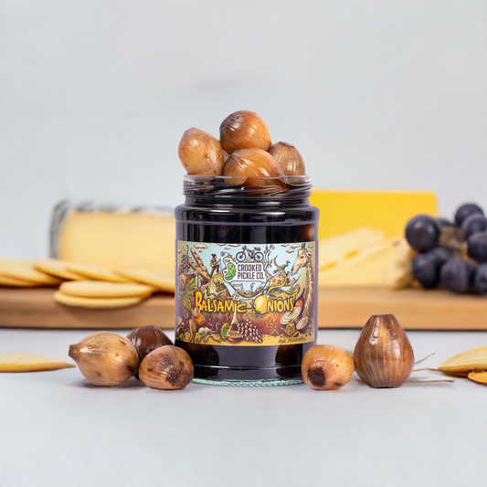 Close-up of dark, crunchy balsamic pickled onions for a cheeseboard.