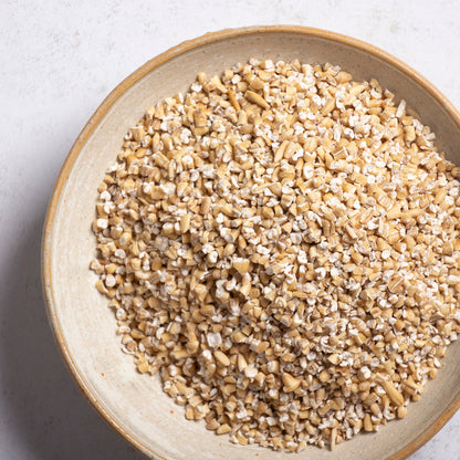 Whole Food Earth Pinhead Oatmeal Coarse Stabilised cereal in a bowl, showing the textured, rustic oat flakes.