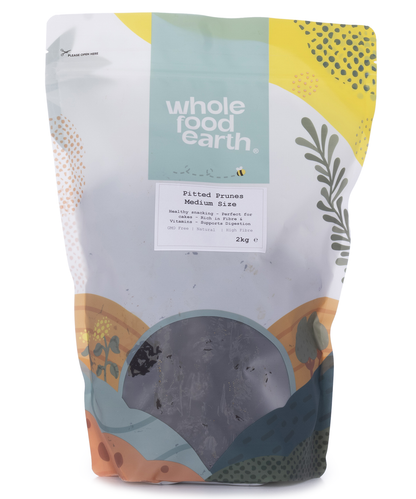 Medium-sized pitted prunes from Whole Food Earth, a dried fruit product, shown in a clear image highlighting their rich, dark color.