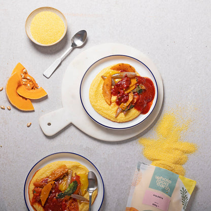 Whole Food Earth polenta in a bowl with corn kernels and herbs, showcasing the versatile gluten-free flour and grain product.