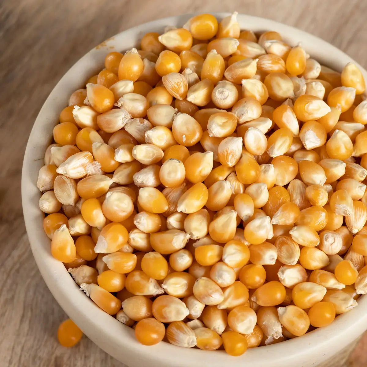 Whole Food Earth popping corn in a bowl, showcasing the natural, unpopped kernels for baking and snack recipes.