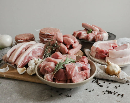 Small Primrose Herd Pork BBQ Pack featuring assorted pork cuts in a meat box for grilling and barbecues.