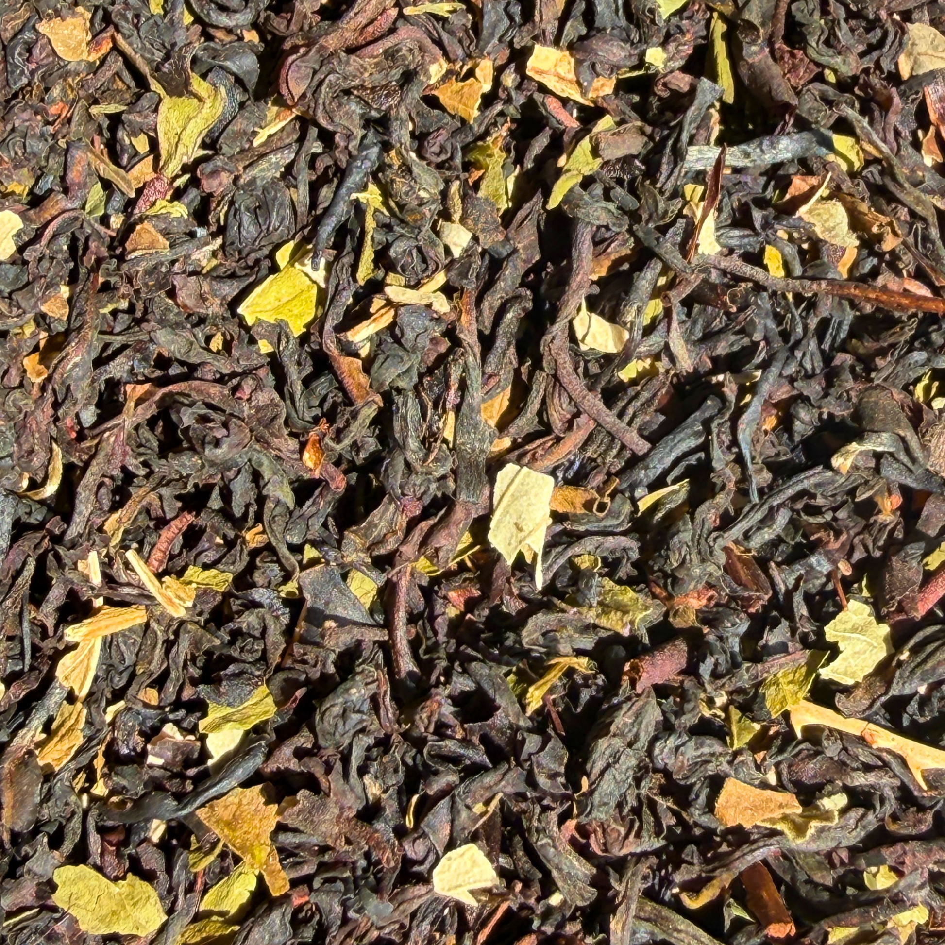 Loose leaf black tea with mint and chocolate chips from Porter Hill Tea Company, showcasing fresh mint leaves, tea leaves, and chocolate pieces.