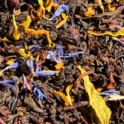 Porter Hill Black Tea with Blueberry and Maple, loose leaf tea in a clear container showing dark tea leaves with berry and maple accents.