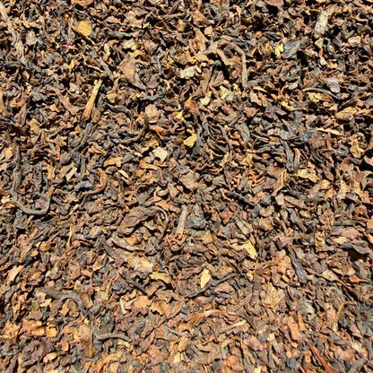 Loose leaf decaf English Breakfast black tea from Porter Hill Tea Company, showing natural dark tea leaves in a clear container.