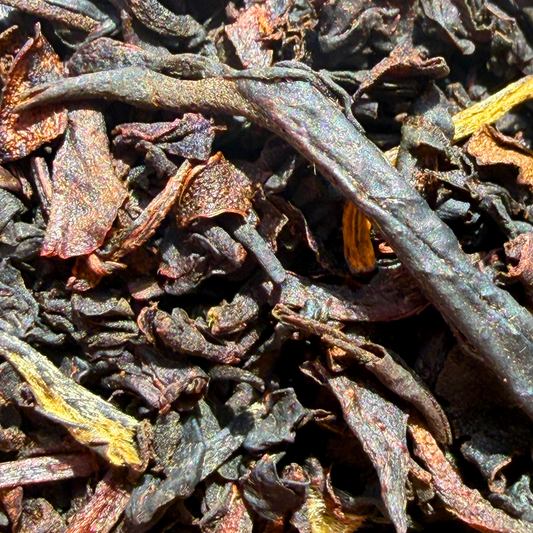 Loose leaf Lychee Congou Black Tea from Porter Hill Tea Company with dark, aromatic tea leaves and hints of lychee flavor.