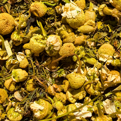 Loose leaf herbal and fruit tea blend called Meadow Morning Walk by Porter Hill Tea Company, displayed in a natural setting.