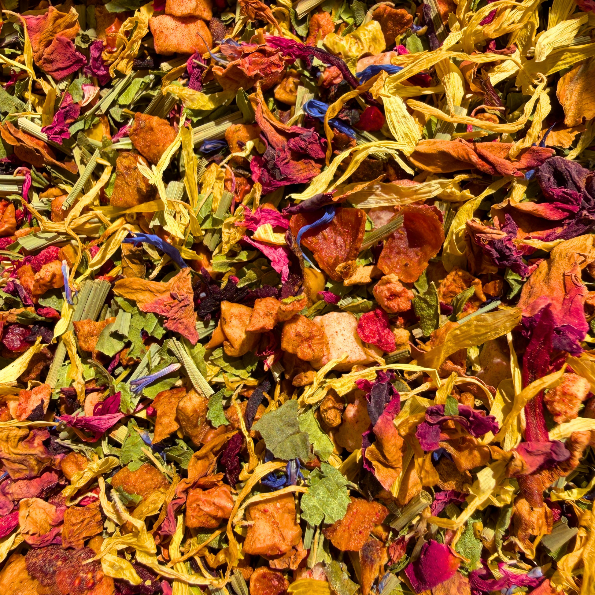 Loose leaf Rainbow Tea by Porter Hill Tea Company, a colorful fruit and herbal blend in natural presentation.