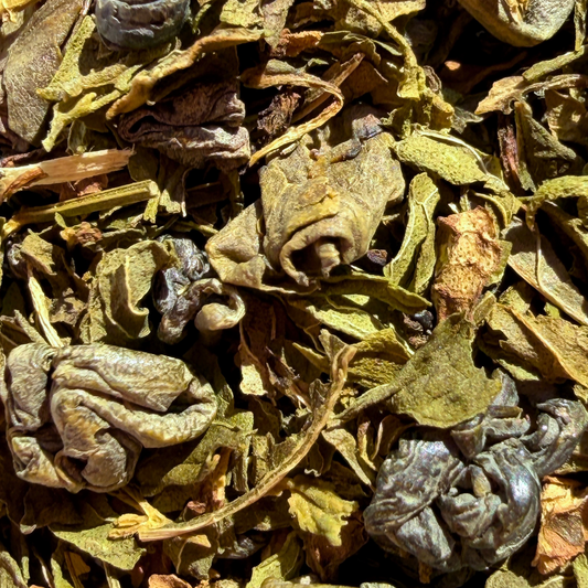 Loose leaf green tea called Mint Bazaar by Porter Hill Tea Company, featuring fresh mint leaves and vibrant green tea leaves.