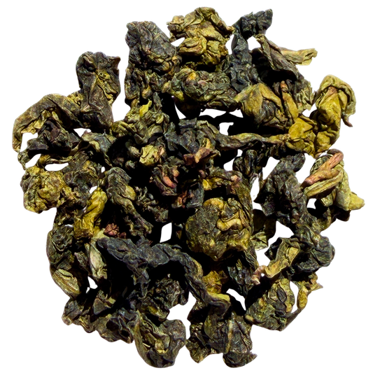 Loose leaf Shangri-La Iced Oolong tea by Porter Hill Tea Company, showcasing dark, twisted oolong tea leaves in a clear container.