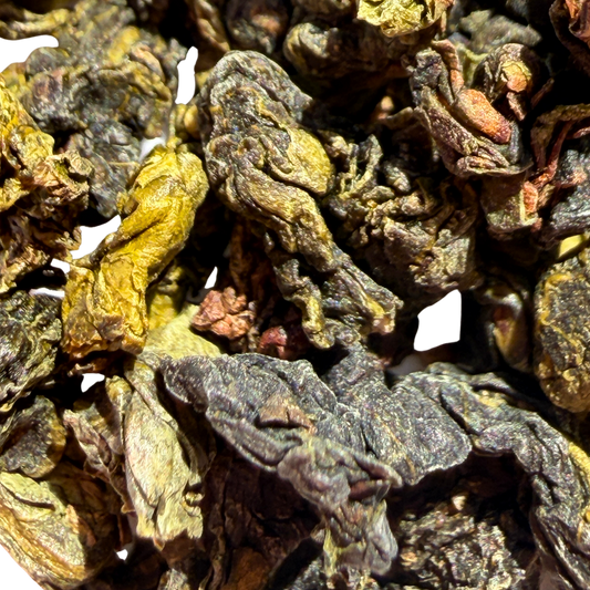 Loose leaf Shangri-La Iced Oolong tea from Porter Hill Tea Company, showcasing dark, twisted oolong tea leaves.