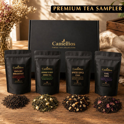 Assorted tea and infusion sampler set by Camellios, featuring multiple tea tins and loose leaf teas in a gift box.