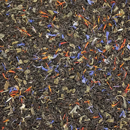 Loose leaf Prince of Wales tea by High Teas in a clear glass jar, showing dark tea leaves and rich texture.