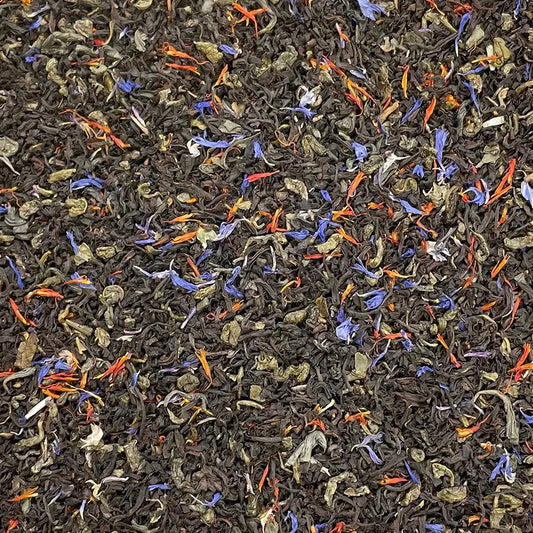 Loose leaf Prince of Wales tea by High Teas in a clear glass jar, showing dark tea leaves and rich texture.