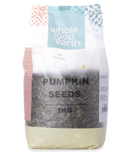 Whole Food Earth pumpkin seeds, 1kg pack, fresh nuts and seeds product with green shells and natural seeds visible.
