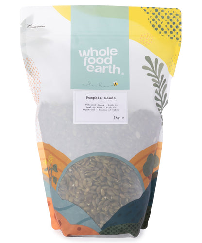 Two kilograms of Whole Food Earth pumpkin seeds, a nutritious nuts and seeds product, shown in a clear image.