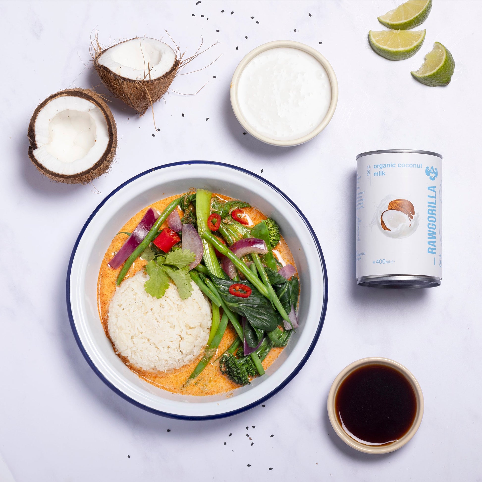 Canned organic coconut milk from RAWGORILLA in a 400ml can, produced by Whole Food Earth, with a smooth, creamy white liquid inside.