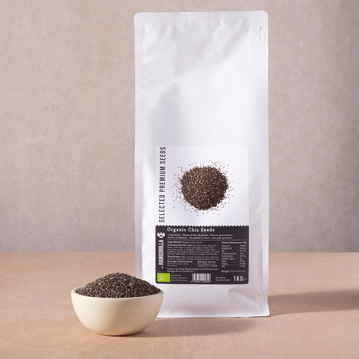 Organic chia seeds in a clear bag from RAWGORILLA, displayed on a white background, showing small black and white seeds.